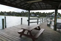 Waterfront property with a quaint one bedroom cottage enjoy old Florida Charm