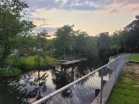 Private Rustic Creekside RV+15 Min Drive to Beach Fenced Parking Lot