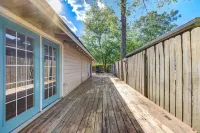 King bed with Pool table, decked patio and, gym.