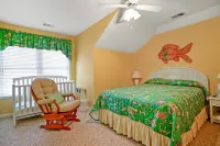 4BR beach getaway steps away from the beach with community pool