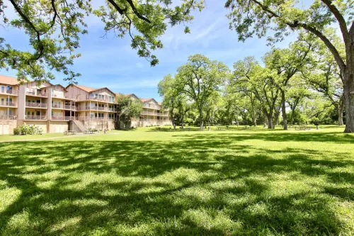 Resort-Style Pools and River-Facing Balcony - Luxurious Waterfront Haven