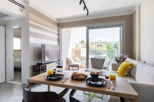 Chic Urban Getaway with Balcony & Mamad by Sea N Rent