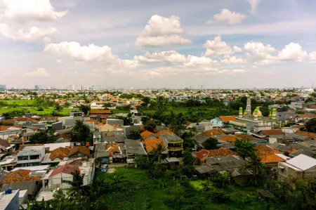 Homey and Cozy Living Studio Poris 88 Apartment