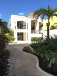 Quiet and serene ocean front 2-bedroom 2-bathroom condo, steps from the sand!