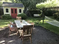 Charming studio cottage on quiet street with beautiful landscaping and gardens.