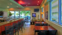 Sunset Vistas Two Bedroom Beachfront Suites - bar
