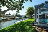 Canalfront Retreat! 2BR + Bunk Nook, Pool & Boat Dock – Easy Water Access!