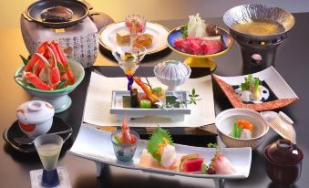 a table is set with various types of food , including sushi and soup , in a japanese restaurant at Zazan Minakami