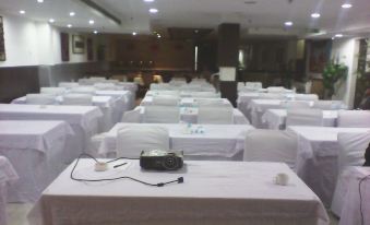 a large conference room filled with tables and chairs , ready for a meeting or event at Amara Hotel