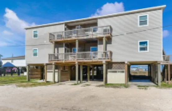 Luxury Beachfront Condo with Covered Deck Steps From Beach & Golf Cart Rental