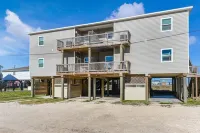 Luxury Beachfront Condo with Covered Deck Steps From Beach & Golf Cart Rental