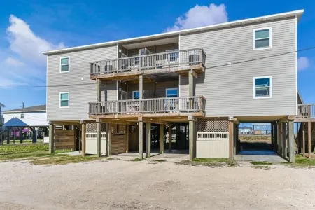 Luxury Beachfront Condo with Covered Deck Steps From Beach & Golf Cart Rental