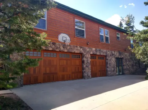 Location!  Nice log home in dark sky community next to several peaks