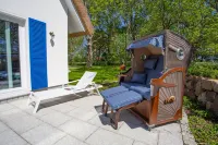 Picturesquely situated thatched-roof house in a large park-like garden