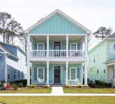 Enjoy sea breezes from double-decker porch -  walk to pool, private waterfront.