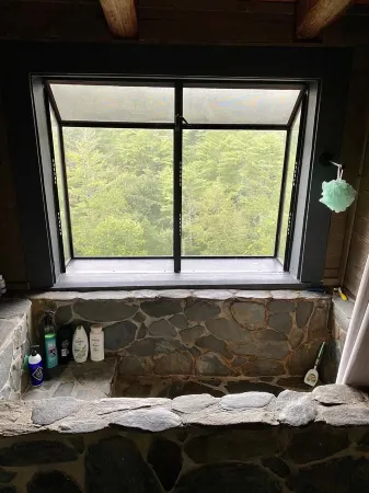 Private Mountain View cabin on 5 acres, great patio with creek below back patio.