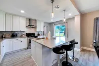 Sleeps 15/ Private Beach & Heated pool /mins to Tampa /Bush Gardens/ Buccs/ Zoo