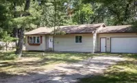 Torch Lake 4 bedroom home w/ large yard & parking