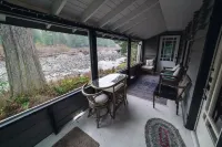 Riverside Mid-Century Cabin with Mountain Views