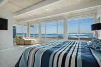 Gorgeous waterfront home with a private hot tub, gas fireplace, & beach access