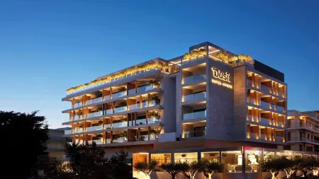 Dusit Suites Athens Отели в г. Глифада