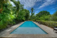 Waterfront Pink House with Private Dock & Pool - Beach