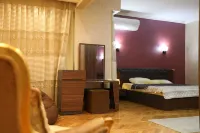 The villa has 3 bedrooms,3 bathrooms,a dining area, and a patio with garden view