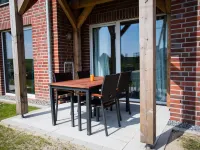 Modern, bright apartment with terrace, directly behind the dike, in the North Sea resort Wremen Hotels in Wremen