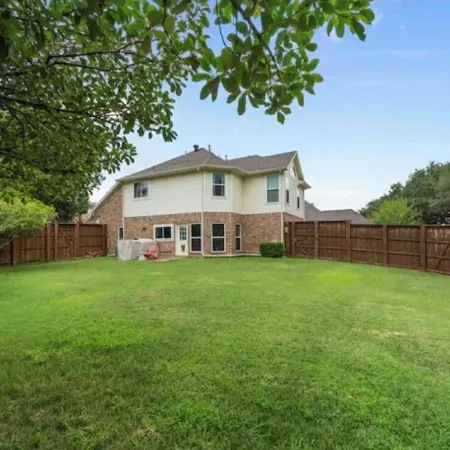 Home away from home with big private fenced backyard
