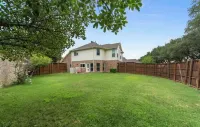 Home away from home with big private fenced backyard