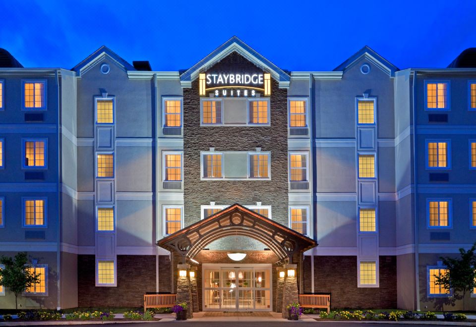 "a large hotel with a sign that reads "" staybridge suites "" prominently displayed on the front of the building" at Staybridge Suites Philadelphia Valley Forge 422