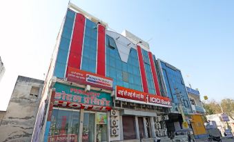 "a modern building with red and blue colors , named "" victor bank "" in chinese characters , situated on a busy street" at Hotel President