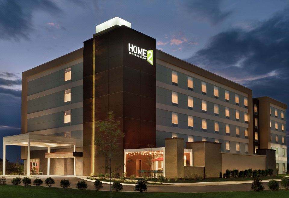 "a large hotel building with the name "" home 2 suites by hilton "" prominently displayed on the front" at Home2 Suites by Hilton Harrisburg North