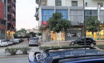 "a blue car is parked in front of a building with a sign that says "" kl ""." at Comfort Hotel