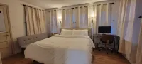 Modern Cozy Retreat: 2 King, 1 Queen, PS5, & Sunroom