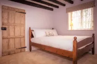 Chocolate-box pretty Pear Tree Cottage in South Downs village