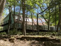Large unique home in the beautiful Ozark Mountains on the Kings River.