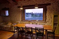 Stone house with garden, barbecue and fireplace.