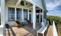 Visit Bald Head Island in March. Peaceful porches with stunning ocean view!