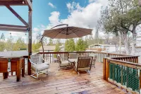 Remodeled partial lake-view home with dock, beach & boat trailer parking
