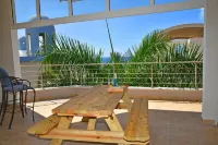 Oceanfront Paradise: Luxurious Penthouse with Spectacular Pools and Peloton