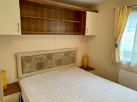 Lotus 2 bedroom dog friendly caravan with veranda offers a stunning sea view.