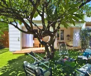 House with Exotic Charm, Private Jacuzzi & Paddle Just a Stone's Throw from the Lagoon!