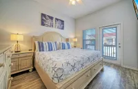 Private Yard Cornhole Resort Pool Oasis w Slide down the Shore by AvantStay