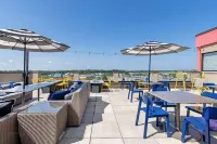 Best Western Plus Executive Residency Rigbys Water World Hotel - bar