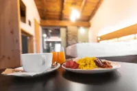 Curt di Clement Eco Mobility Hotel - Bữa sáng