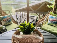 Lakehouse with 3 Decks, 2 Covered Boat Slips & Swim Dock!!