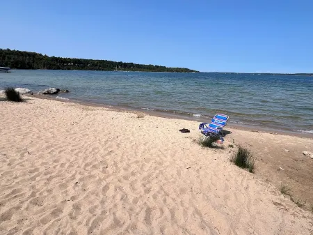 Ironton Stone Cottage, walk to Lake Charlevoix beach.