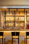 Theos Village Apartments - bar