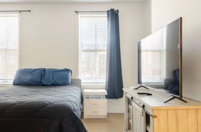 Cozy Downtown Loft: 2BR condo w/ AC, WiFi, Balcony & Free 2-car parking.